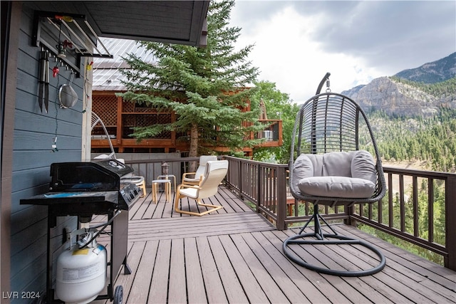 wooden terrace with a mountain view