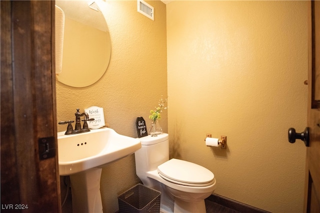 bathroom featuring toilet