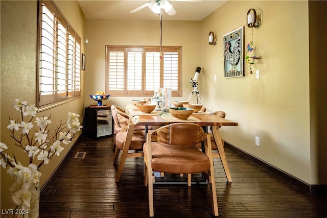 dining space featuring plenty of natural light, ceiling fan, and dark hardwood / wood-style floors