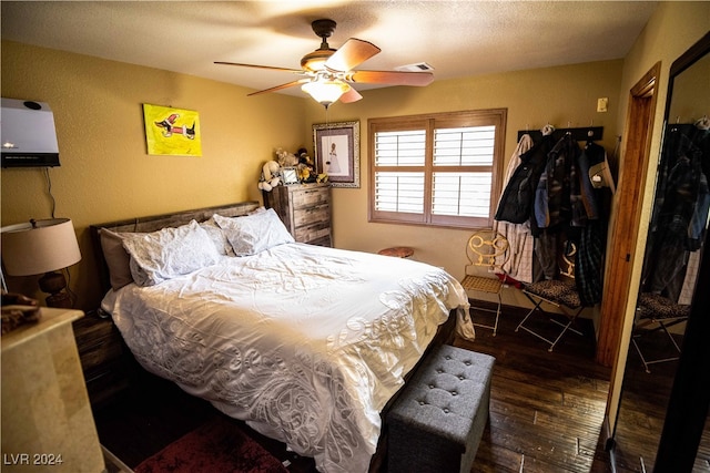 bedroom featuring ceiling fan and hardwood / wood-style floors