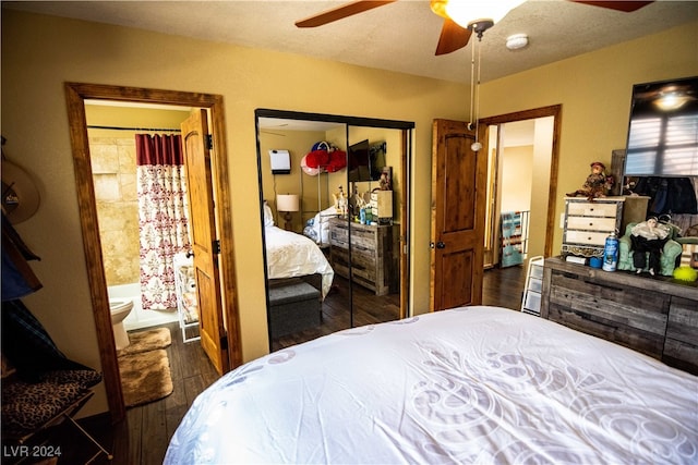 bedroom featuring ceiling fan, dark wood-type flooring, and a closet