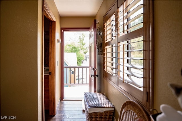 doorway to outside with wood-type flooring