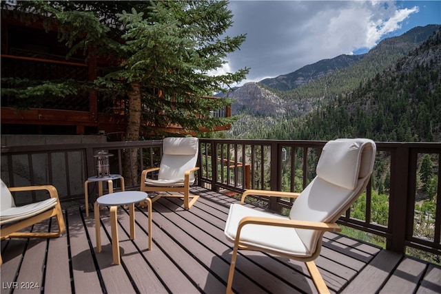 wooden deck featuring a mountain view