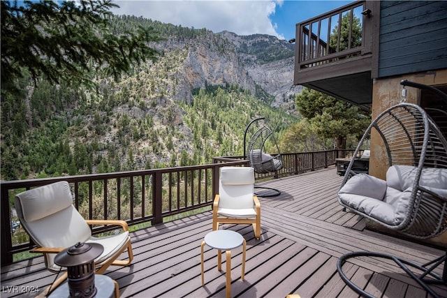 wooden terrace featuring a mountain view