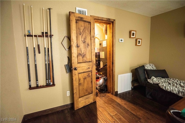 bedroom featuring dark hardwood / wood-style flooring