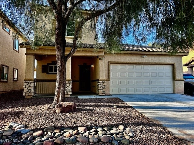 view of front of property featuring a garage