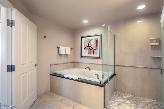 bathroom featuring a stall shower, recessed lighting, a garden tub, and tile patterned floors