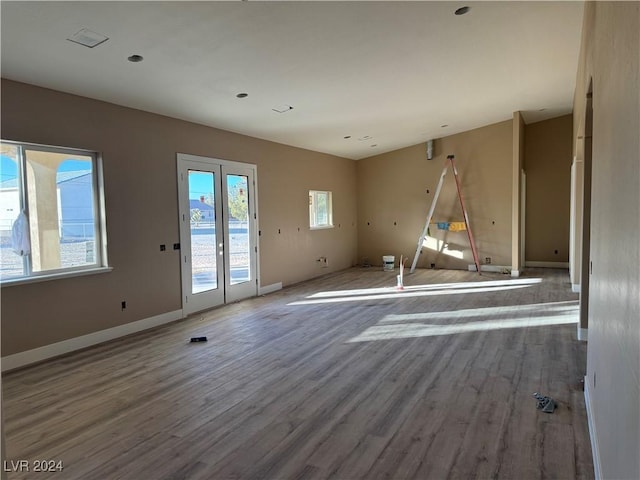 spare room featuring wood-type flooring