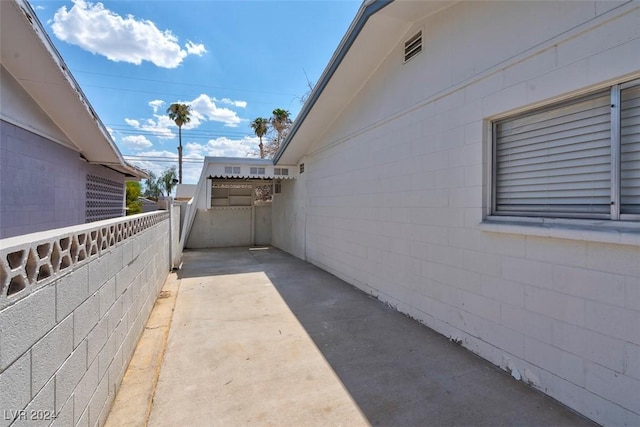 view of side of property with a patio area