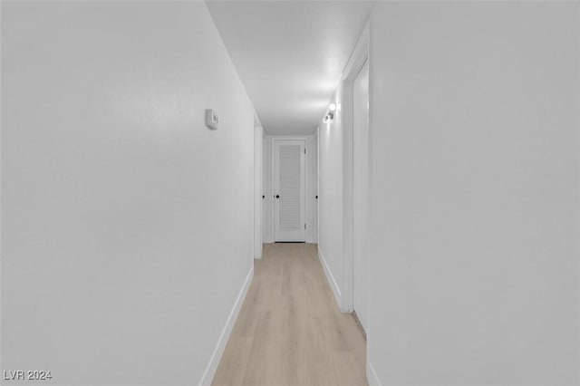 hall with light wood-type flooring