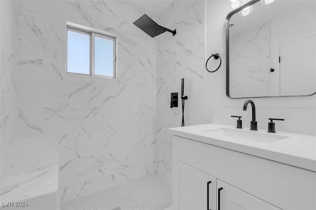 bathroom with vanity and tiled shower