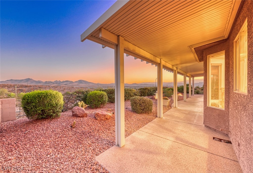 patio terrace at dusk with a mountain view