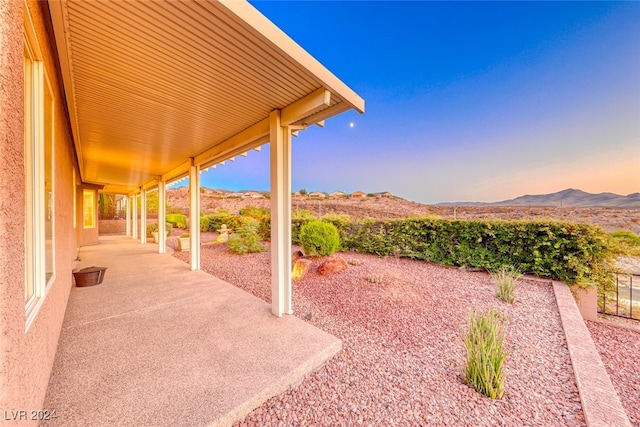 view of patio / terrace featuring a mountain view