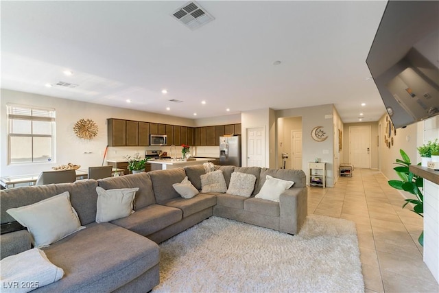 living room with light tile patterned flooring