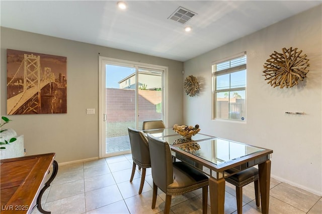 tiled dining area with a healthy amount of sunlight