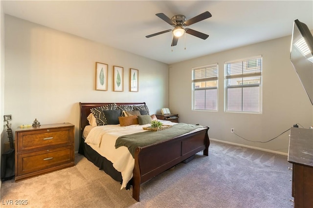 bedroom featuring ceiling fan and light carpet