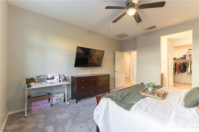 bedroom featuring light colored carpet and ceiling fan