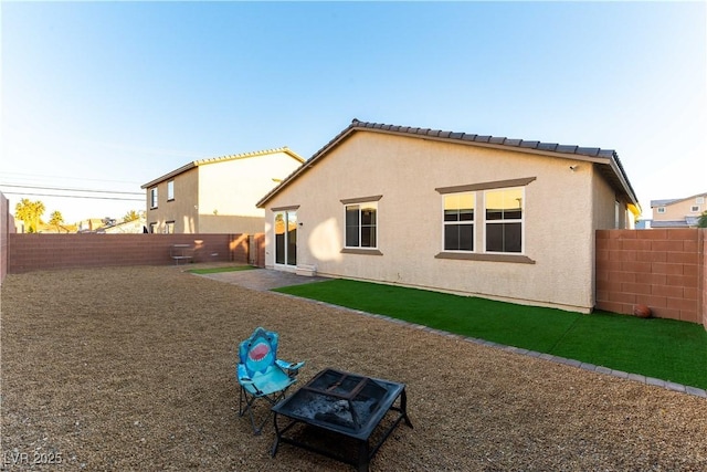 back of property with a patio area