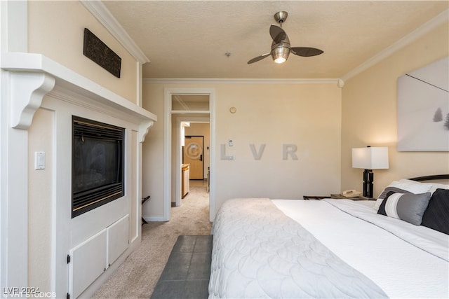 bedroom with ceiling fan, carpet floors, and ornamental molding