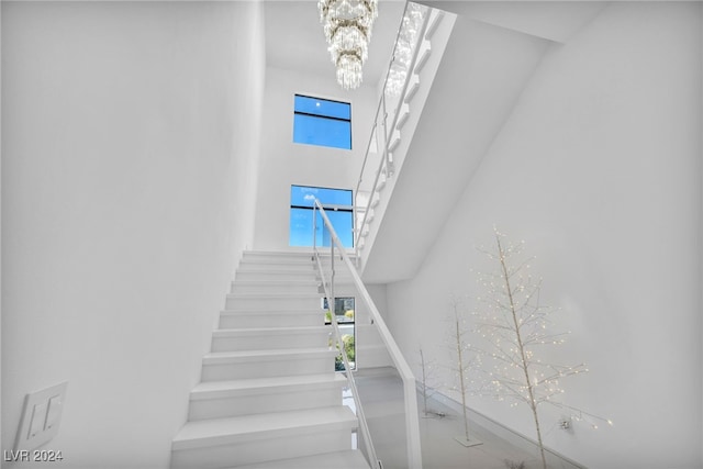 9760 Solar Ave, Las Vegas, NV 89149 - stairs featuring a towering ceiling and a chandelier