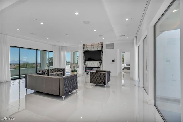 9760 Solar Ave, Las Vegas, NV 89149 - living room featuring light tile patterned floors, recessed lighting, and a high end fireplace
