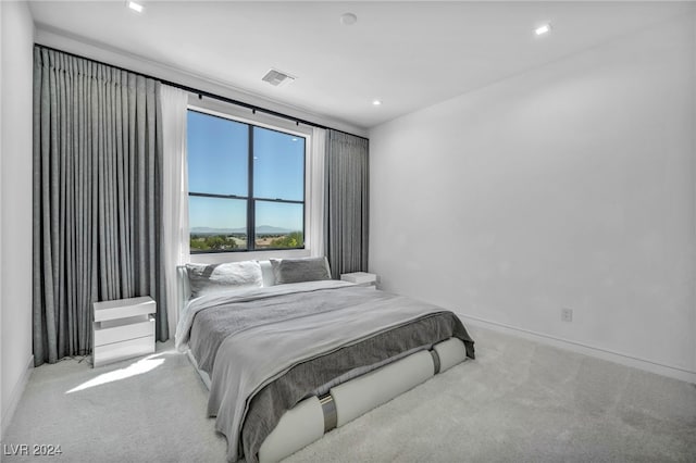 carpeted bedroom featuring baseboards, visible vents, and recessed lighting