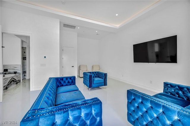 living area with visible vents and recessed lighting