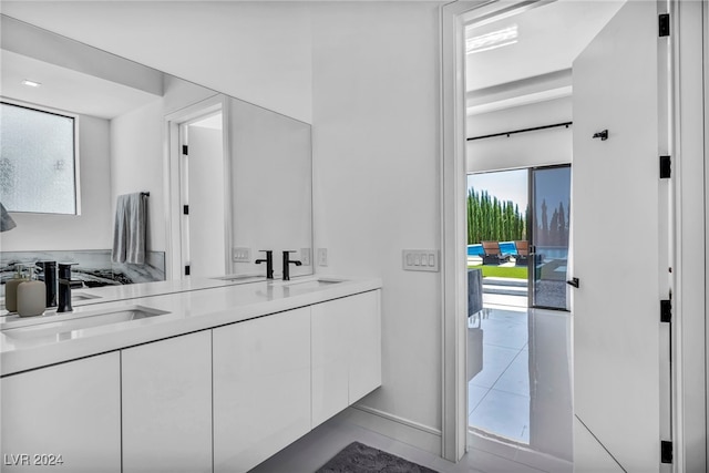 bathroom featuring double vanity and a sink