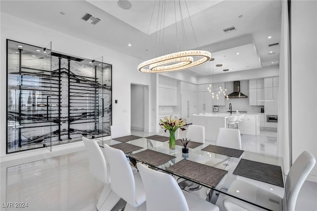 9760 Solar Ave, Las Vegas, NV 89149 - dining space featuring a chandelier, a raised ceiling, and recessed lighting
