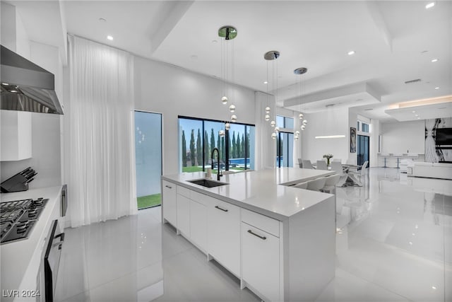 9760 Solar Ave, Las Vegas, NV 89149 - kitchen featuring a sink, modern cabinets, open floor plan, white cabinetry, and light tile patterned flooring