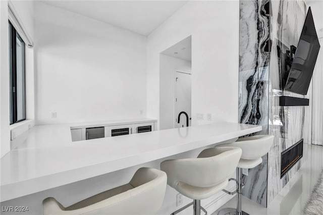 9760 Solar Ave, Las Vegas, NV 89149 - kitchen featuring a kitchen breakfast bar