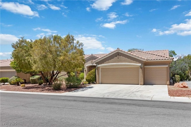 1629 Black Fox Canyon Rd, Henderson, NV 89052 - view of front of house with an attached garage, a tiled roof, stucco siding, and driveway