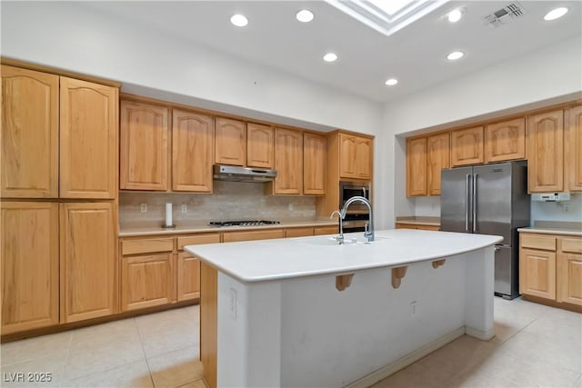 1629 Black Fox Canyon Rd, Henderson, NV 89052 - kitchen with appliances with stainless steel finishes, light countertops, a center island with sink, a sink, and recessed lighting