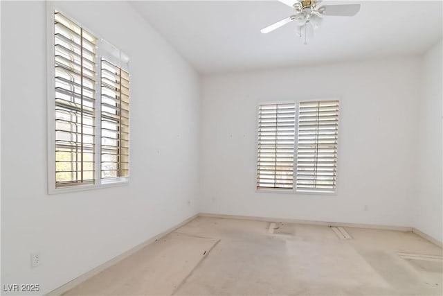 1629 Black Fox Canyon Rd, Henderson, NV 89052 - spare room featuring plenty of natural light, a ceiling fan, and baseboards