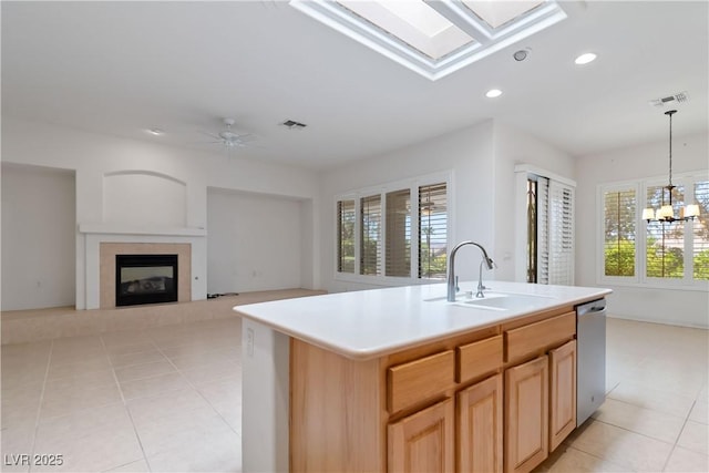 1629 Black Fox Canyon Rd, Henderson, NV 89052 - kitchen featuring a sink, stainless steel dishwasher, light tile patterned flooring, recessed lighting, and a glass covered fireplace