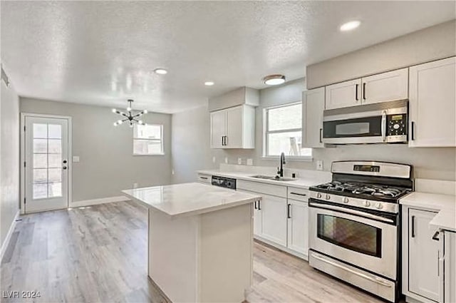 kitchen with appliances with stainless steel finishes, sink, and a wealth of natural light