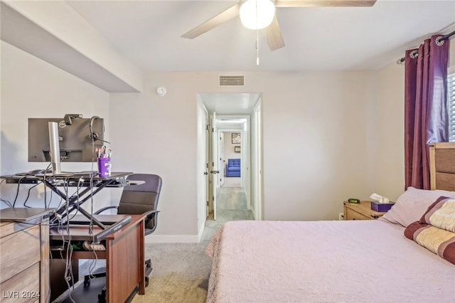 bedroom featuring light carpet and ceiling fan