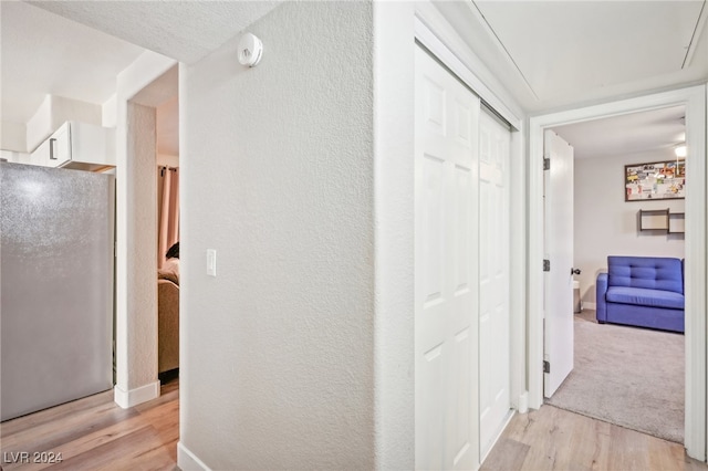 hall with light wood-type flooring