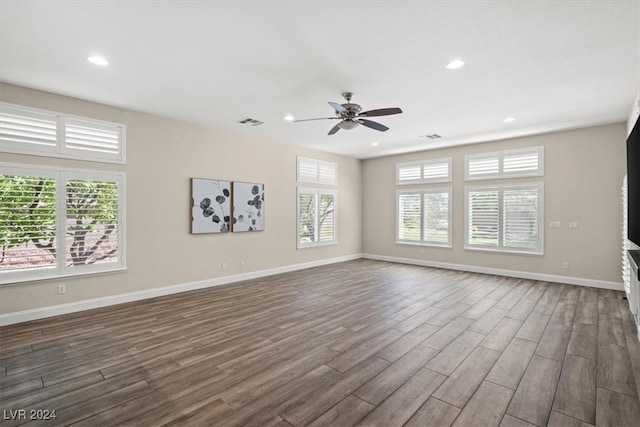 empty room featuring ceiling fan and dark hardwood / wood-style floors