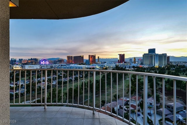 balcony at dusk with a city view