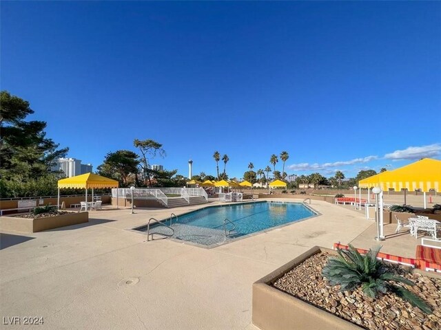 view of swimming pool featuring a patio