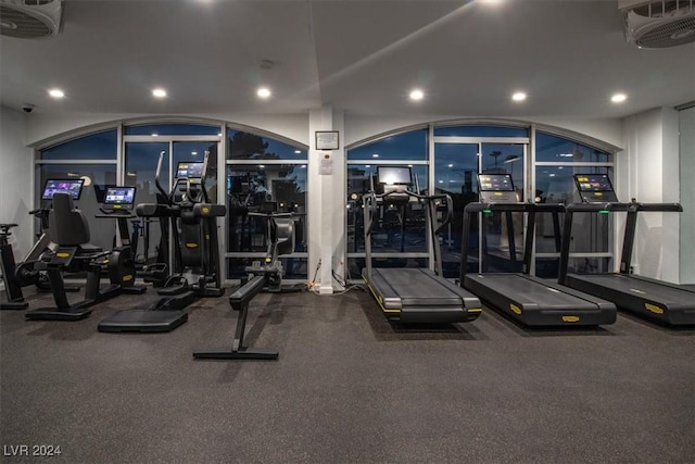 exercise room with visible vents and recessed lighting