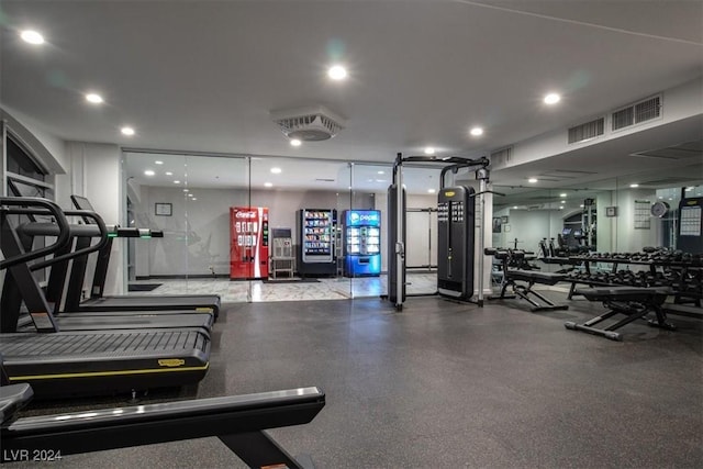 exercise room with visible vents and recessed lighting