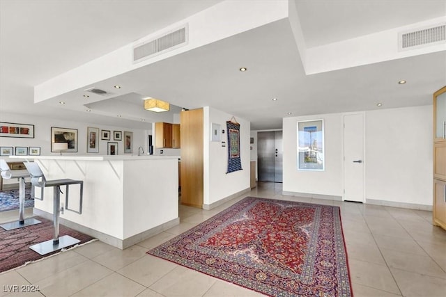 kitchen featuring light tile patterned floors, visible vents, and recessed lighting