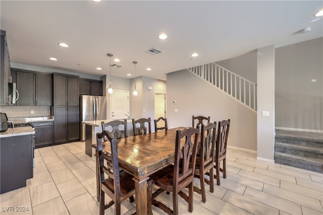 dining area with light tile patterned flooring