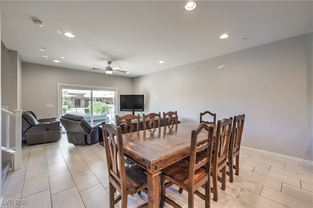 dining area featuring ceiling fan and light tile patterned flooring