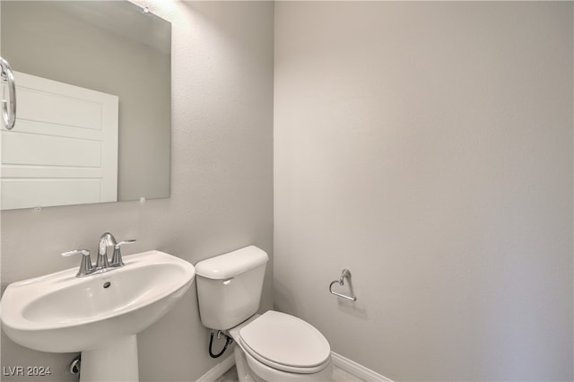 bathroom with sink and toilet