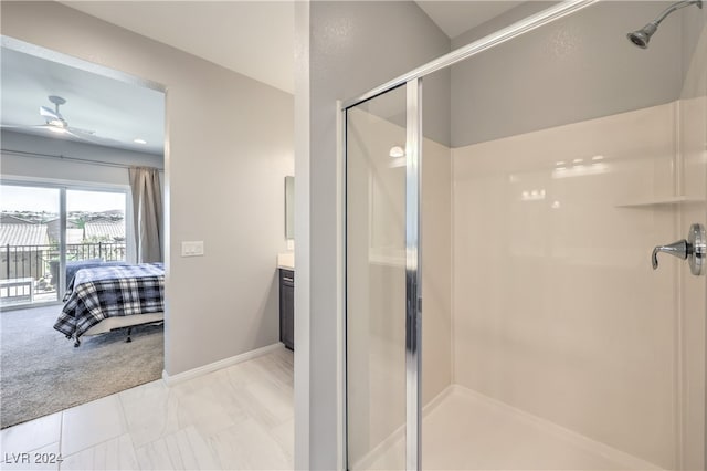 bathroom with ceiling fan, an enclosed shower, tile patterned floors, and vanity