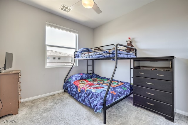 bedroom with ceiling fan and light carpet