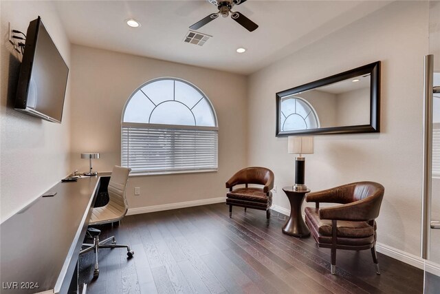 home office with ceiling fan and dark hardwood / wood-style floors